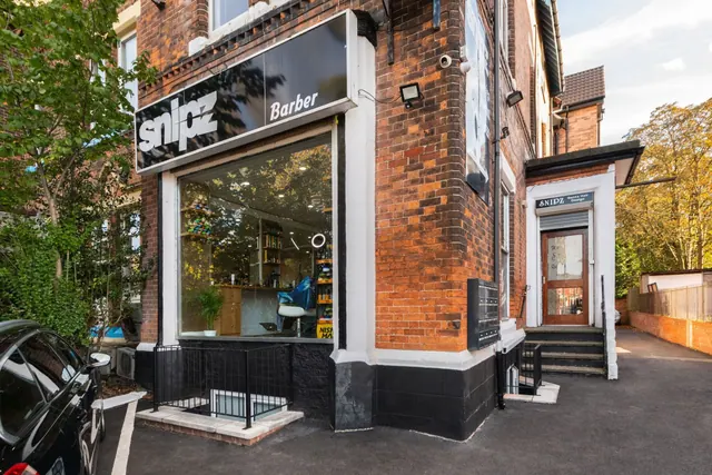 The Snipz Barber shopfront on Wilmslow Road